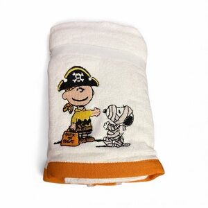 Peanuts White and Orange Hand Towel with Trick-or-Treat Design